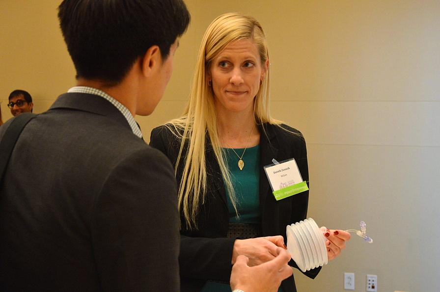 Danielle demonstrates wound pump at Impact Investing Showcase